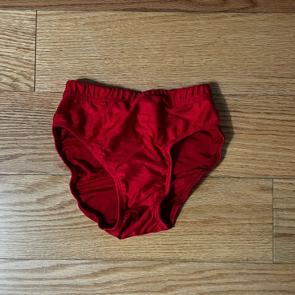 Red gymnastics trunks